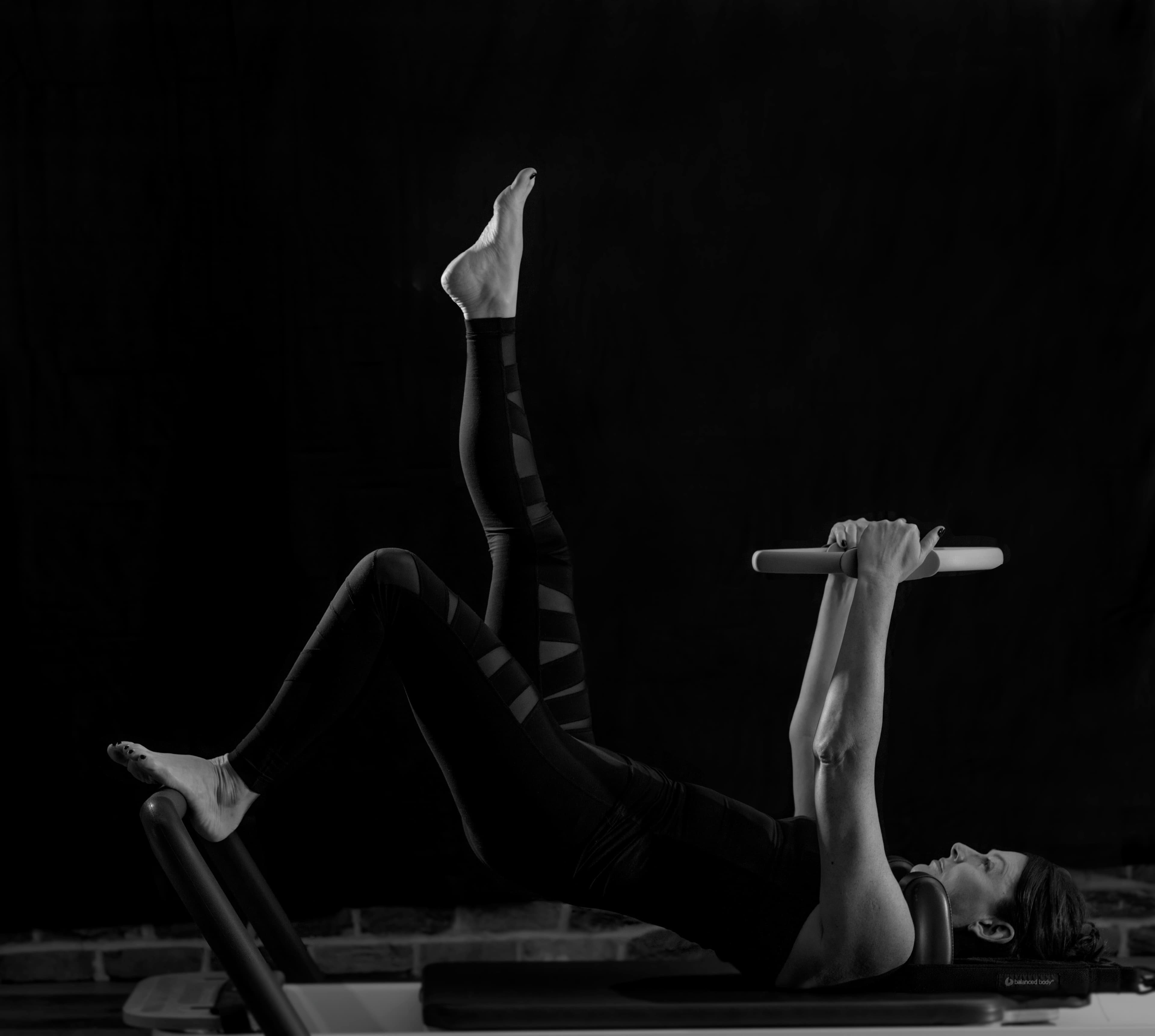 Private Pilates instruction using studio equipment